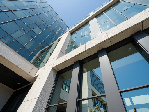 江苏双金安防科技集团有限公司办公大楼外观，现代化建筑风格，绿色植物环绕，体现企业实力与环保理念